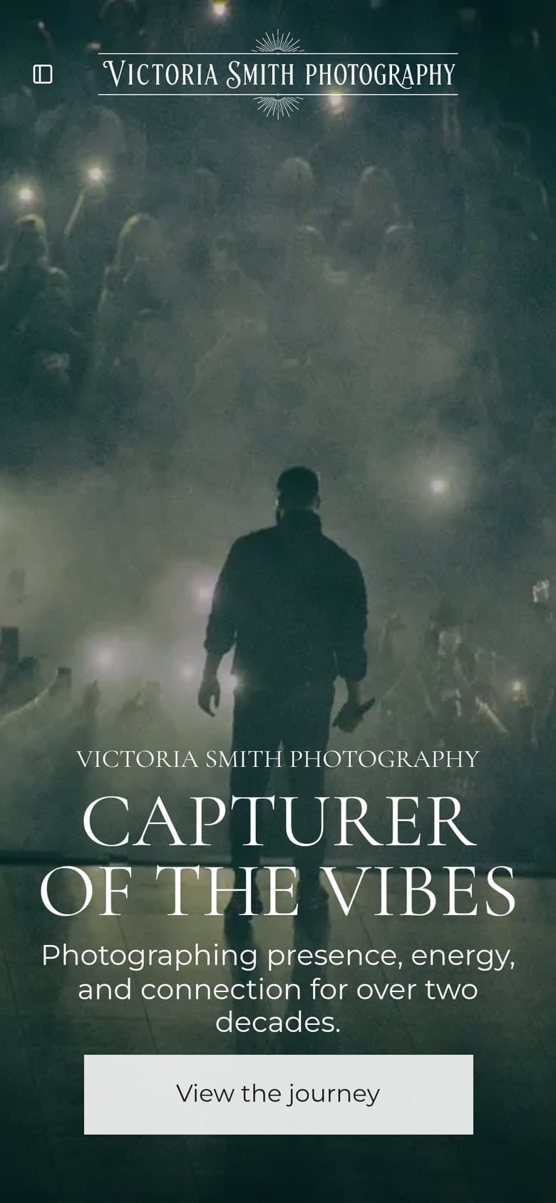 The victoriasmithphoto.com home page on a phone